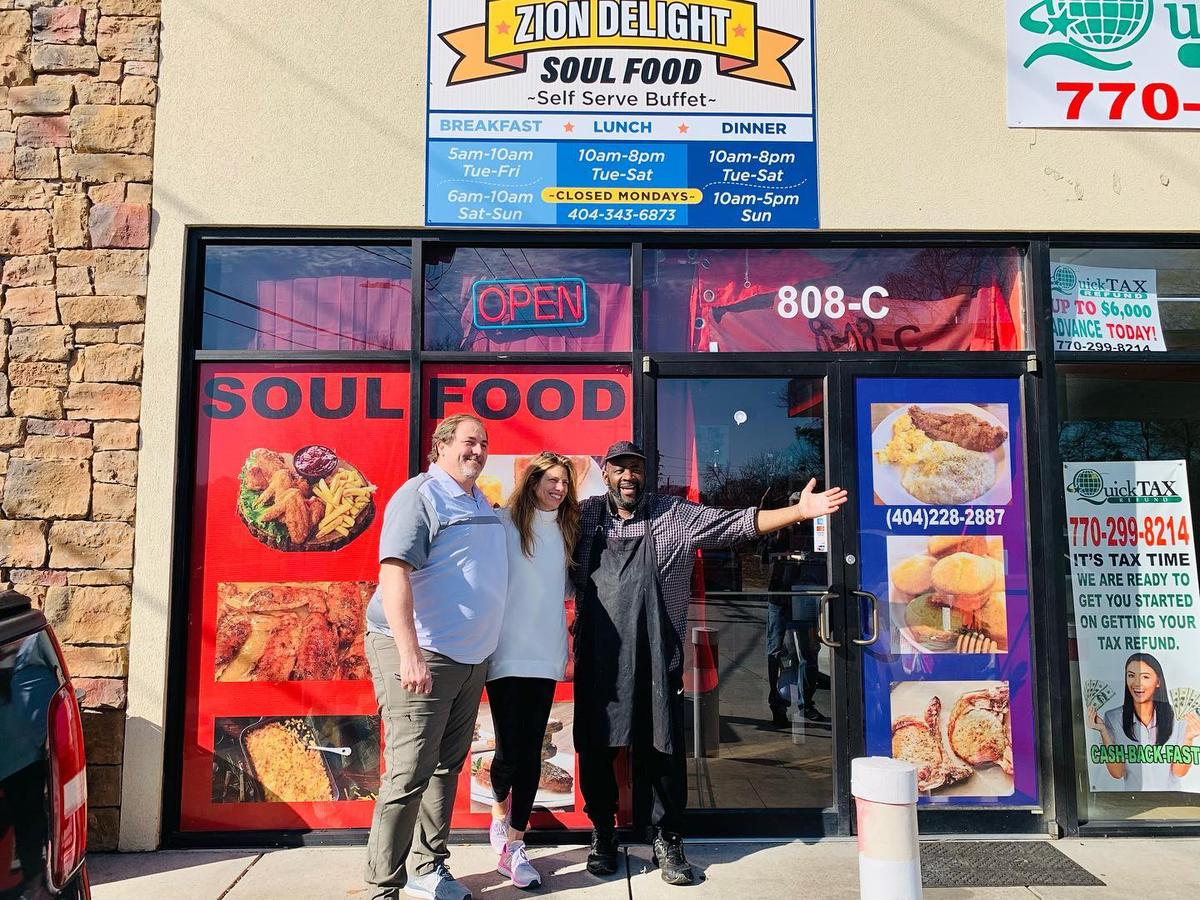 Earl Campbell and guests outside Zion Delight Soul Food at 808 McDonough Blvd SE, Atlanta