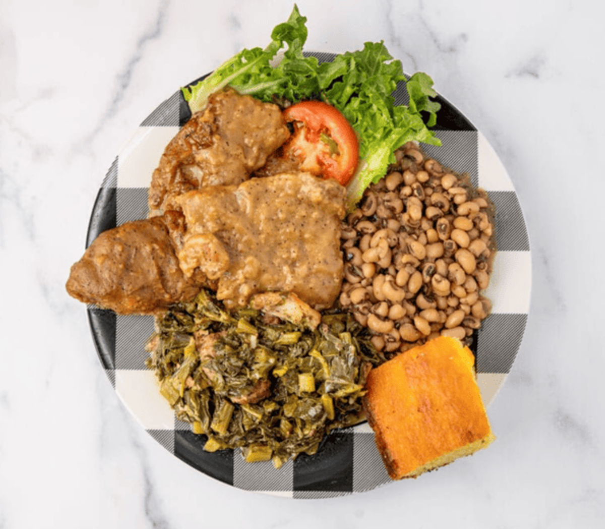Zion Delight smothered pork chops with collard greens, black-eyed peas and cornbread — Atlanta soul food