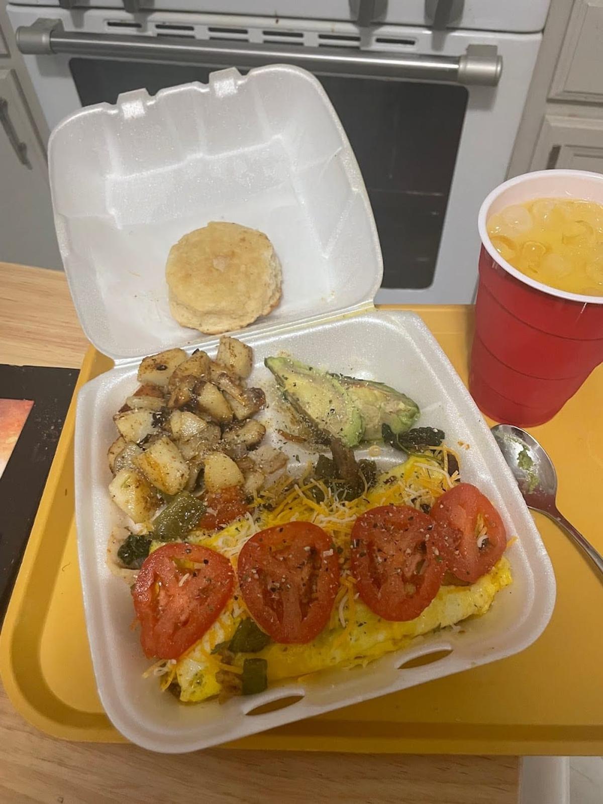 Zion Delight breakfast box — veggie omelette, roasted potatoes, avocado, biscuit and sweet tea, Atlanta