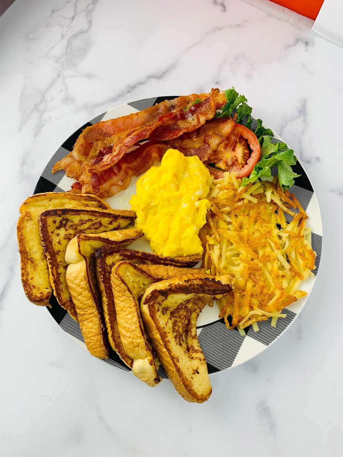 Zion Delight breakfast plate — French toast, scrambled eggs, crispy bacon and hash browns, Atlanta