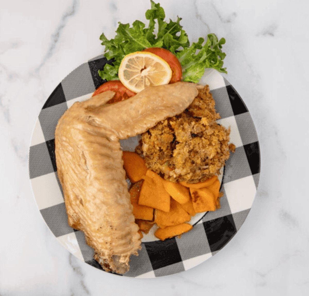 Zion Delight fried whiting fish plate with stuffing and candied yams — soul food Atlanta