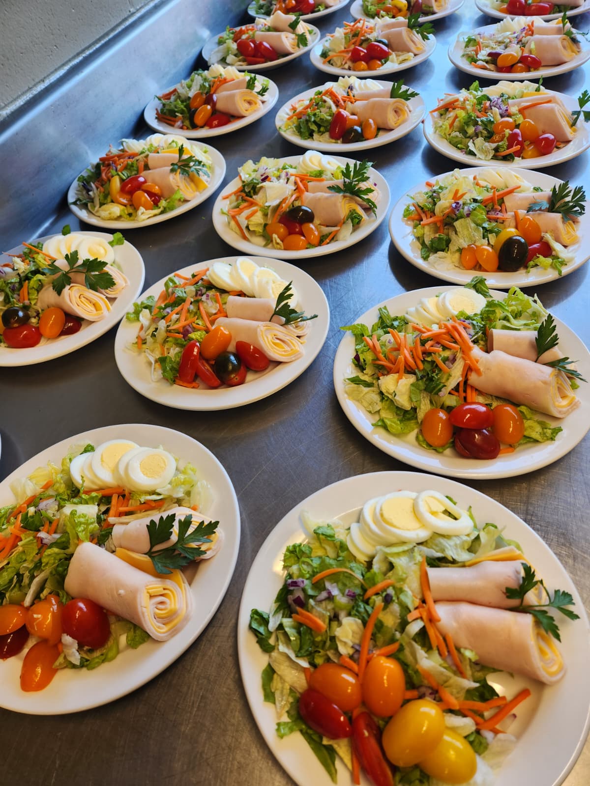 table for of plates of nutritious tasty looking salads