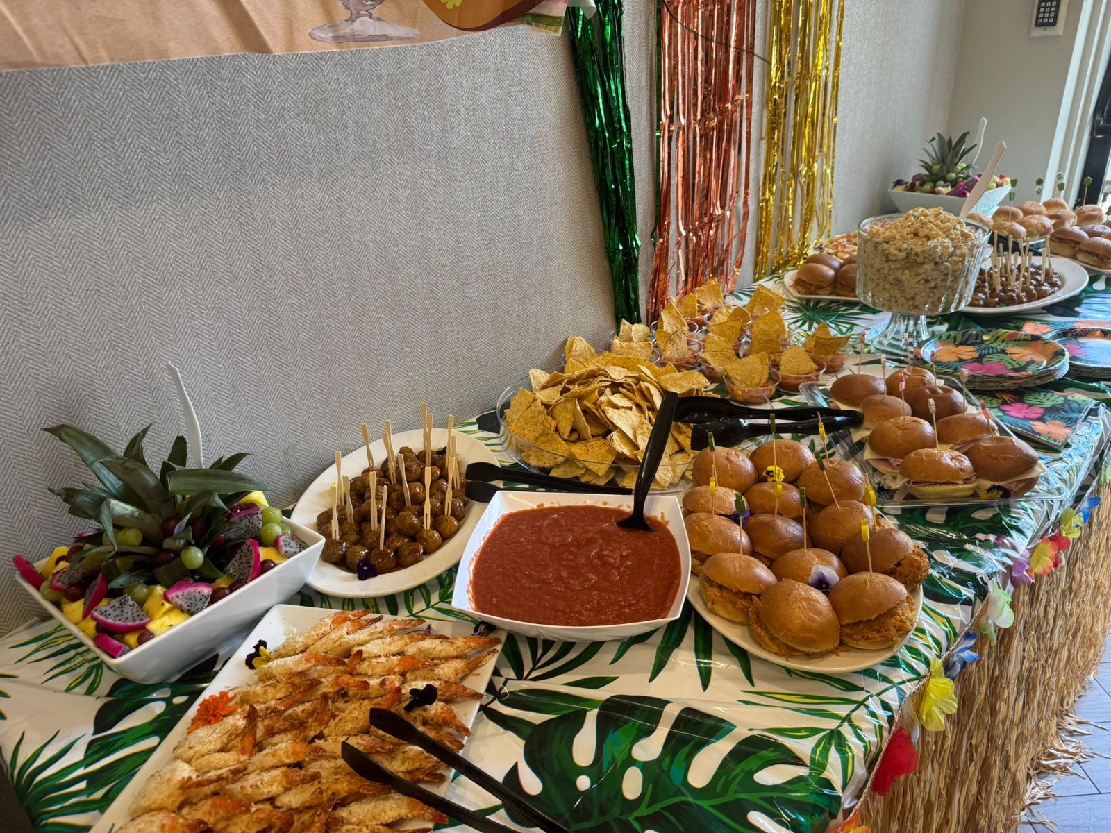 table with assorted party style foods in a senior living facility