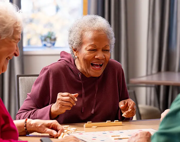 older ladies enjoying a game of scrabble