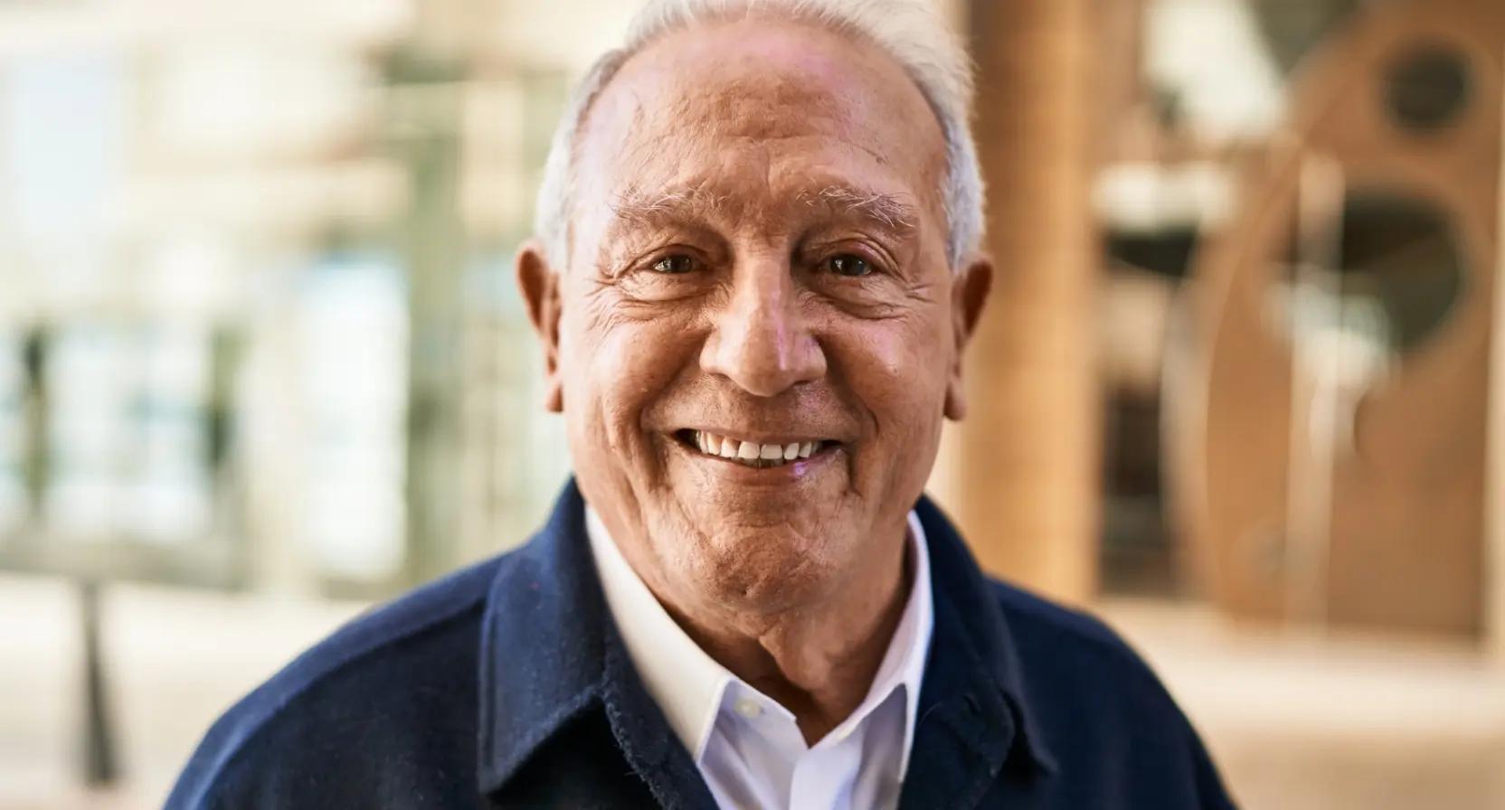 older man smiling at the camera