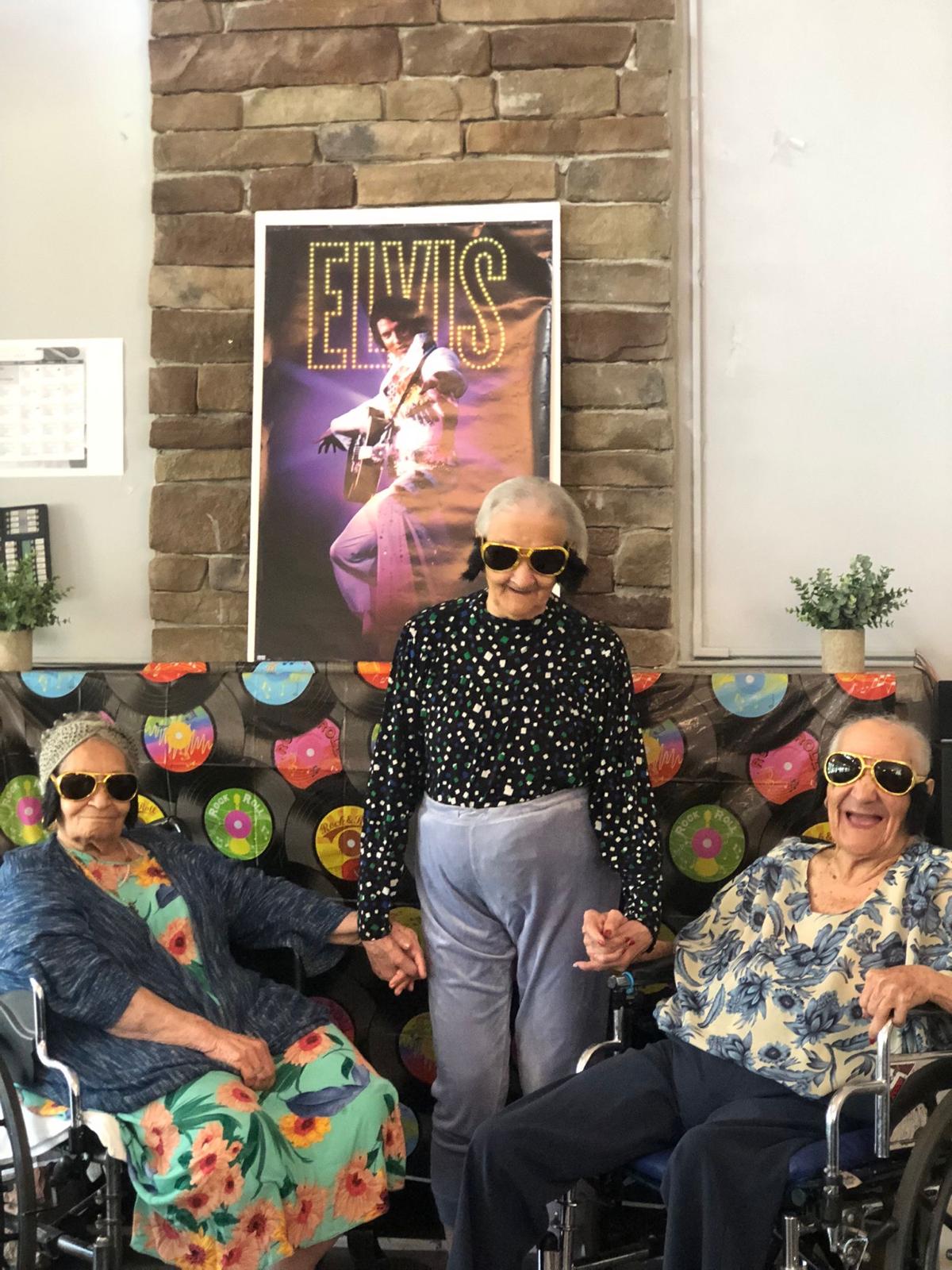 older women celebrating Elvis in themed event in nursing home