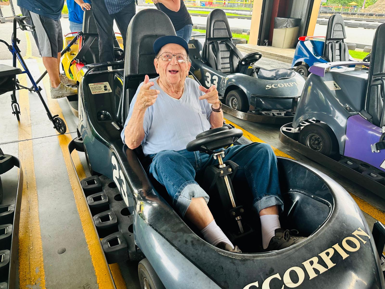 older man having a great time in a go kart