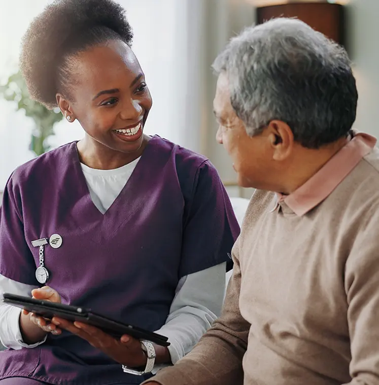happy young nurse consulting older man