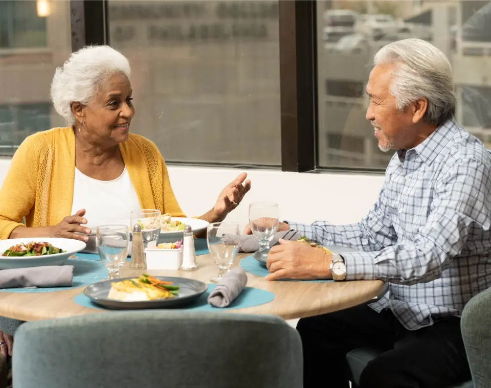 older adults enjoying a meal together