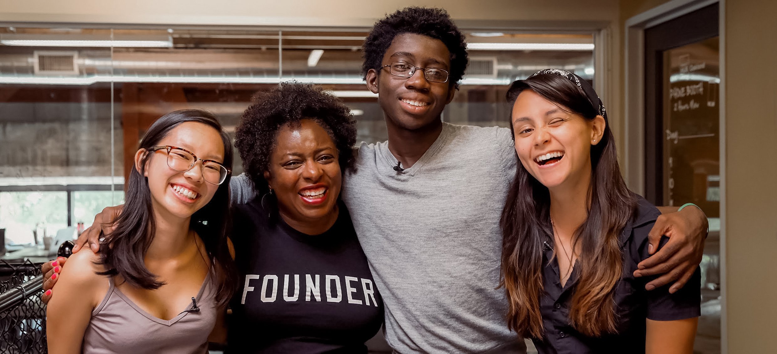 Three young aspiring tech leaders meet with a startup founder.