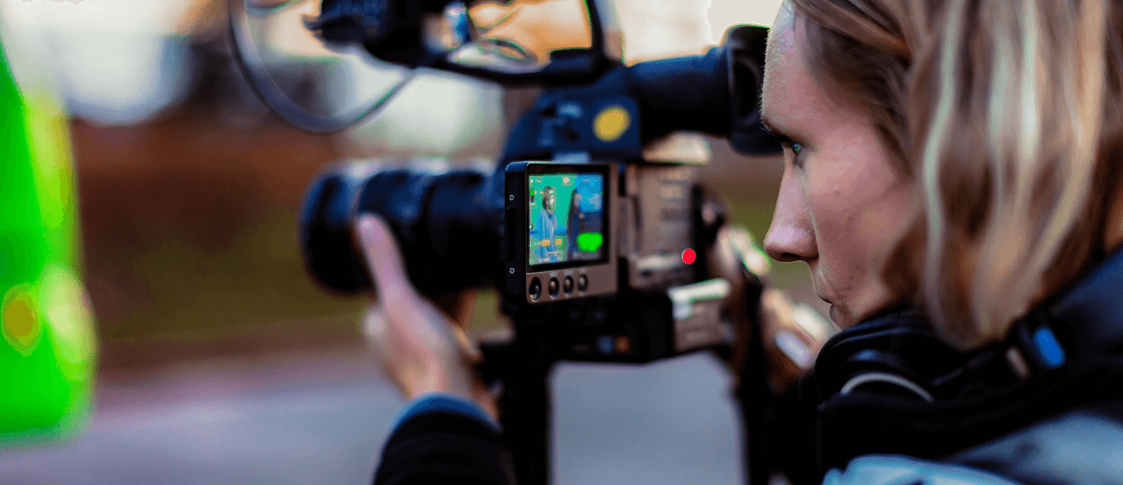 A Roadtrip Nation director looks through her camera.