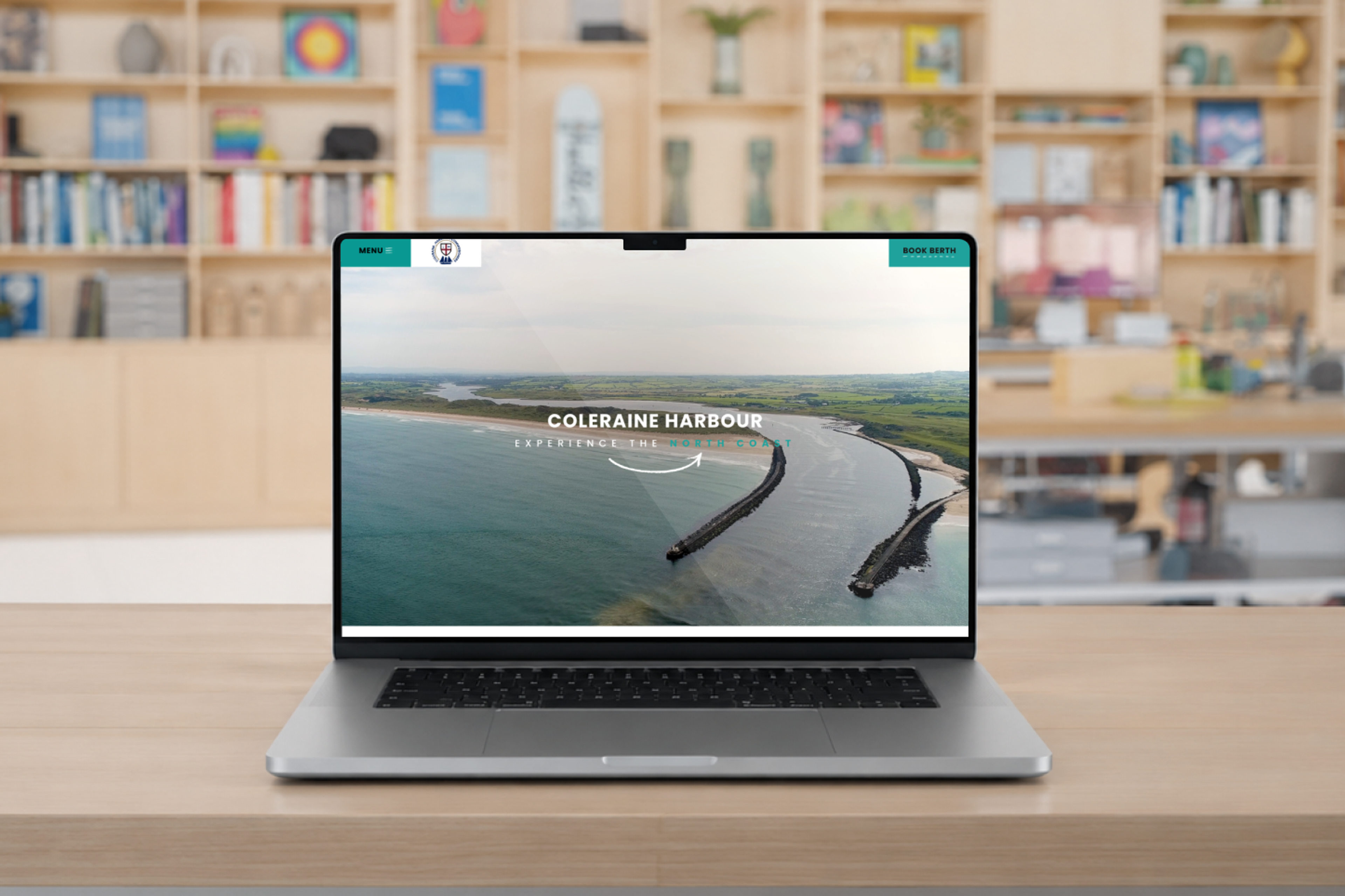 Coleraine Harbour Commissioners website loaded on a laptop in an office environment