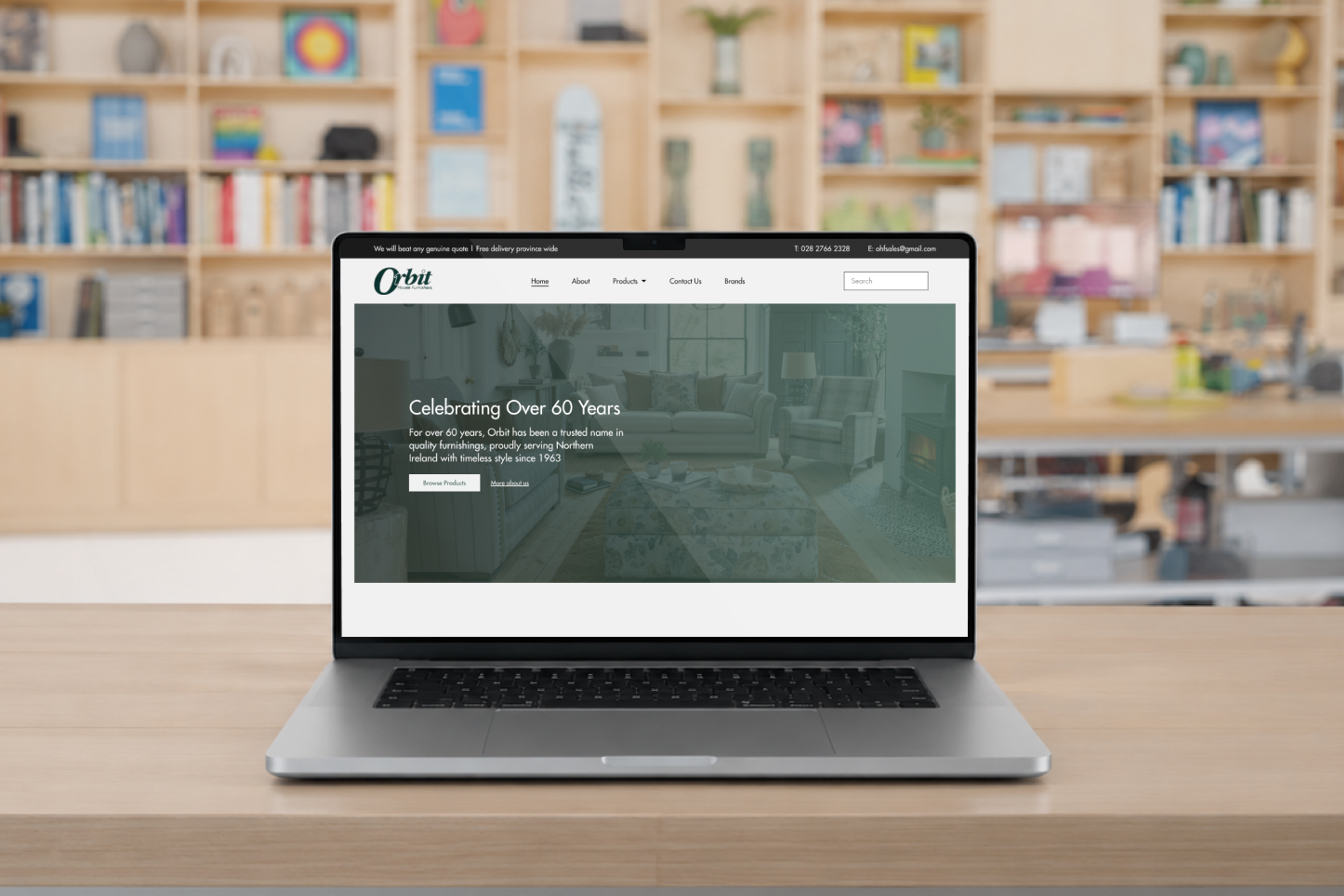 Orbit House Furnishers new website loaded on a MacBook Pro in a studio