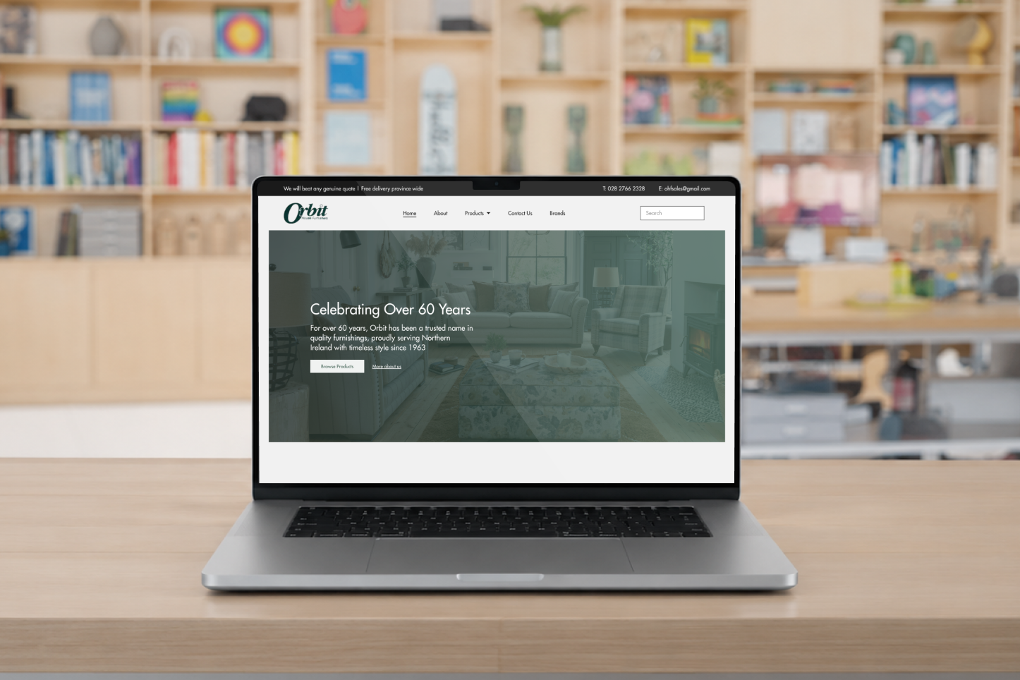 Orbit House Furnishers new website loaded on a MacBook Pro in a studio