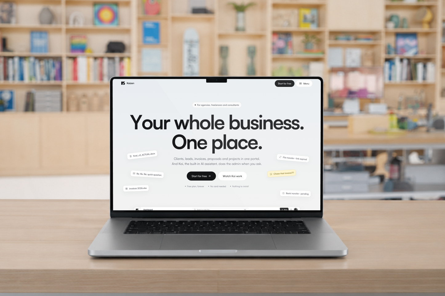 The Kaizen website homepage shown on a laptop on a wooden desk, with the headline “Your whole business. One place.” and floating notes like final_v3_ACTUAL.docx and Chase that invoice, designed and built by Lowe Design.