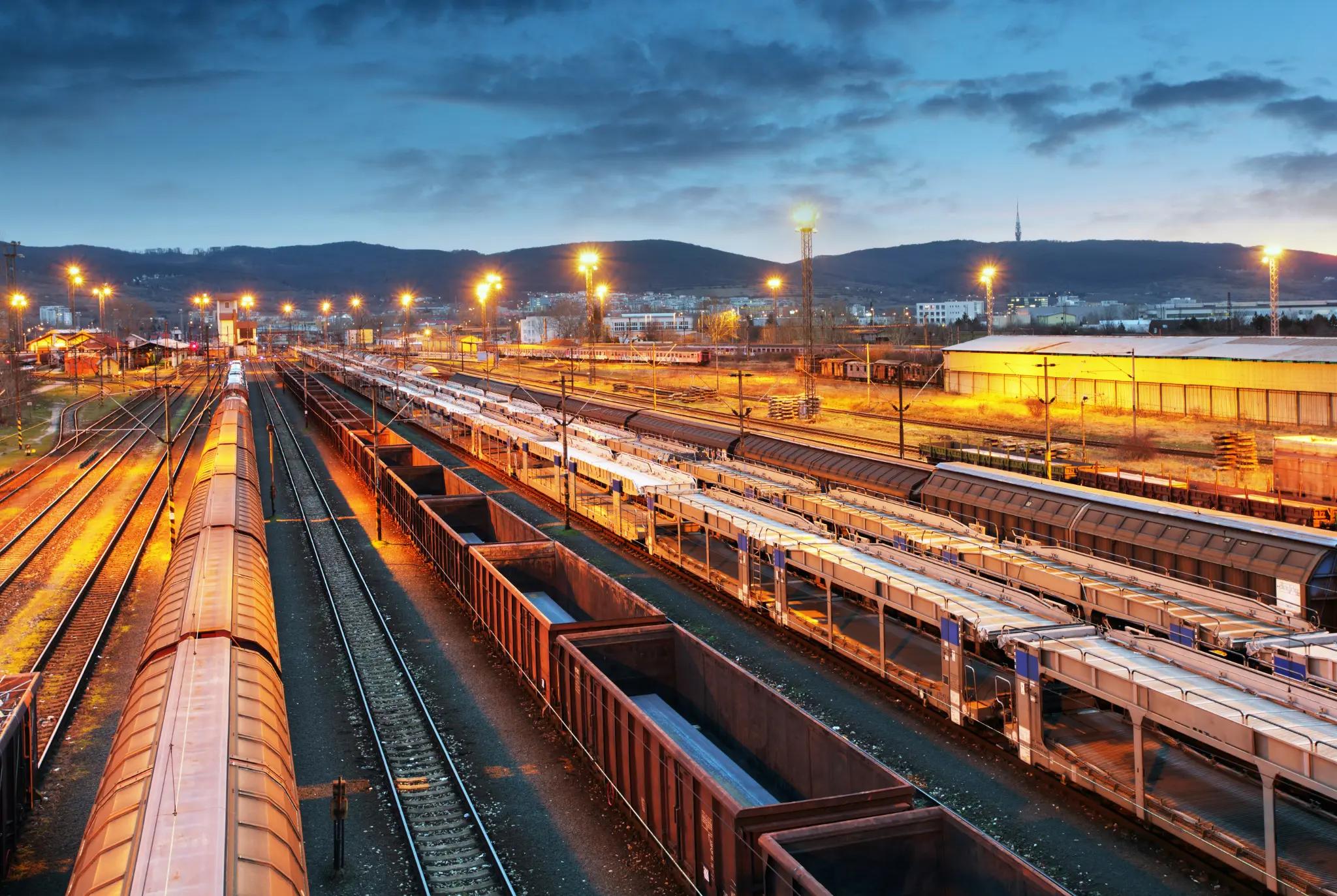 Rail yard at night with operations being managed by supply chain solutions. 
