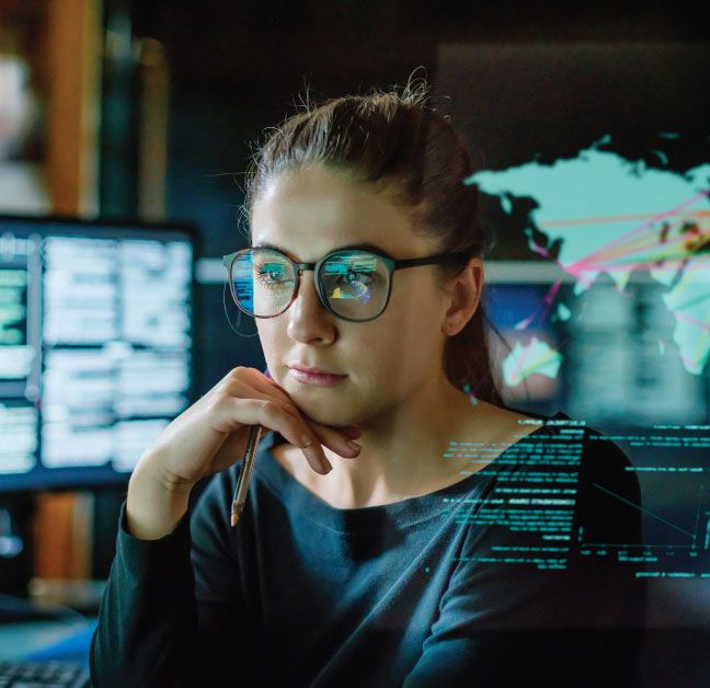 Woman in supply chain working on a desktop computer.