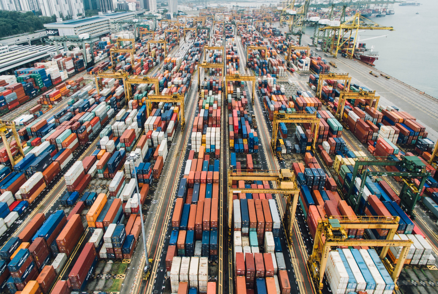 Cargo containers lay in a shipyard. Qwyk, the digital freight start-up, has signed an agreement with Chain.io, the logistics integration platform for 3PLs, digital forwarders, shippers and SaaS providers.
