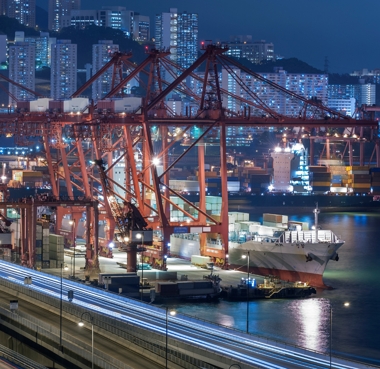 Port at night with data being shared through supply chain integrations