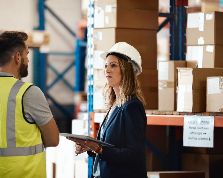 Logistics and supply chain employees planning with data from supply chain visibility platforms. 