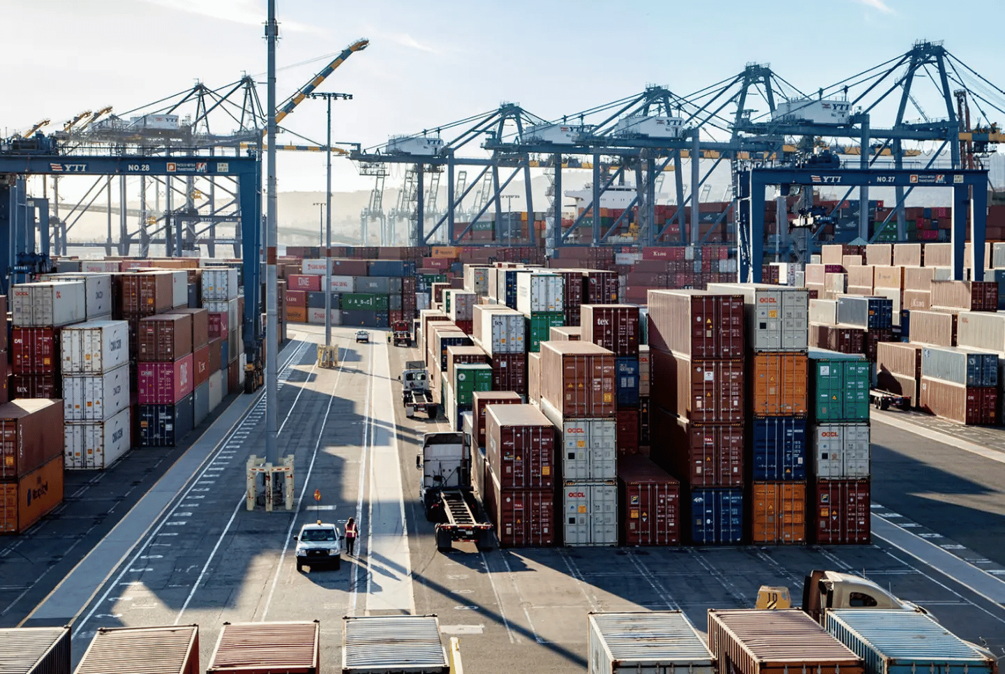 Busy port with containers piling up. TMS integrations can allow you to free up your internal resources without hiring additional team members or spending months on complex integrations. 