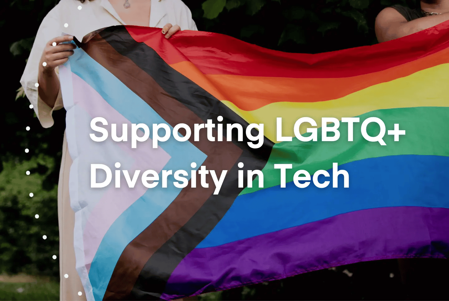 Supply chain professionals holding the pride flag with the text "Supporting LGBTQ+ Diversity in Tech"