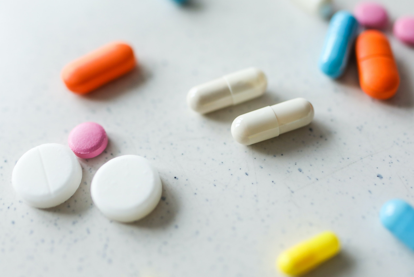 Image of medicine and vitamins on white background.