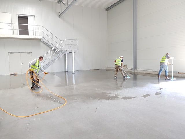 Construction workers spraying concrete floors. Yesterday, we announced that Chain.io will be supporting the Digital Container Shipping Association standard for Track & Trace. Here's why this is a really big deal...