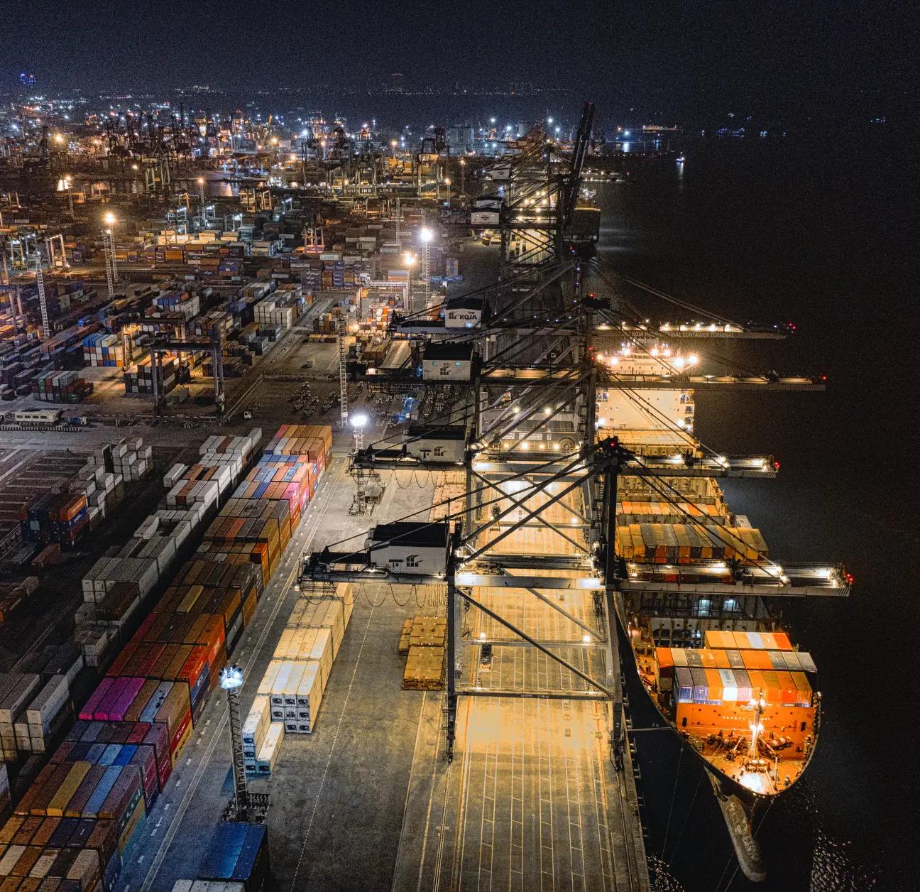 Port at night being managed by logistics automation software. 