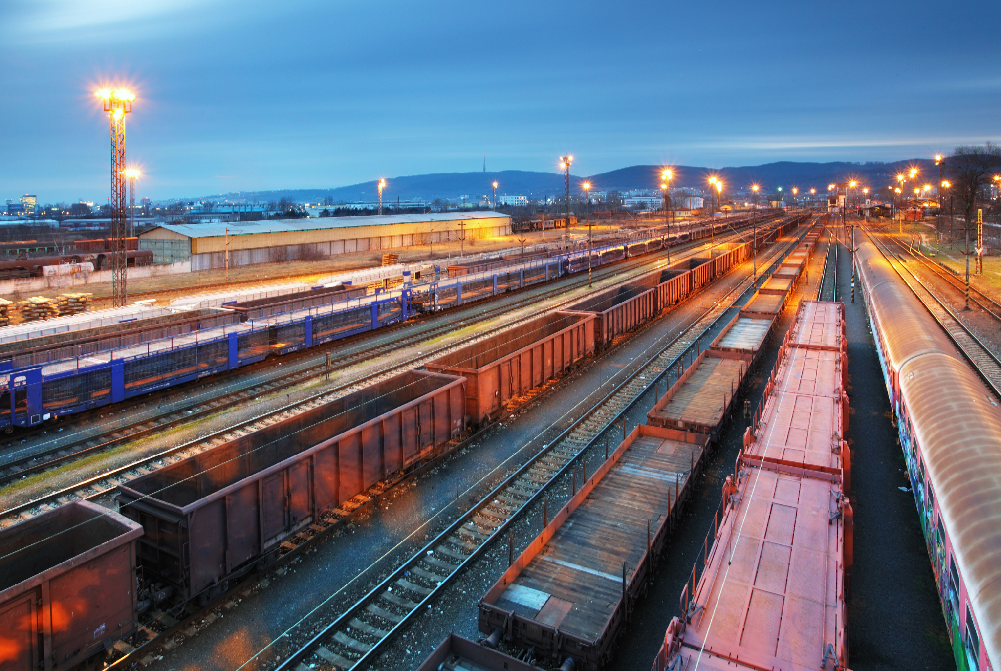 Rail yard with cargo being managed through supply chain automations