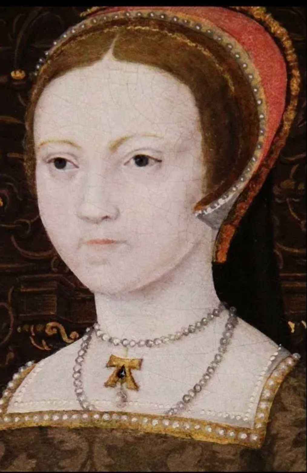 Queen Elizabeth I as a teenager wearing what is believed to be an ‘A’ pendant belonging to her late mother, Anne Boleyn. detail from “The Family of Henry VIII,” c. 1545.