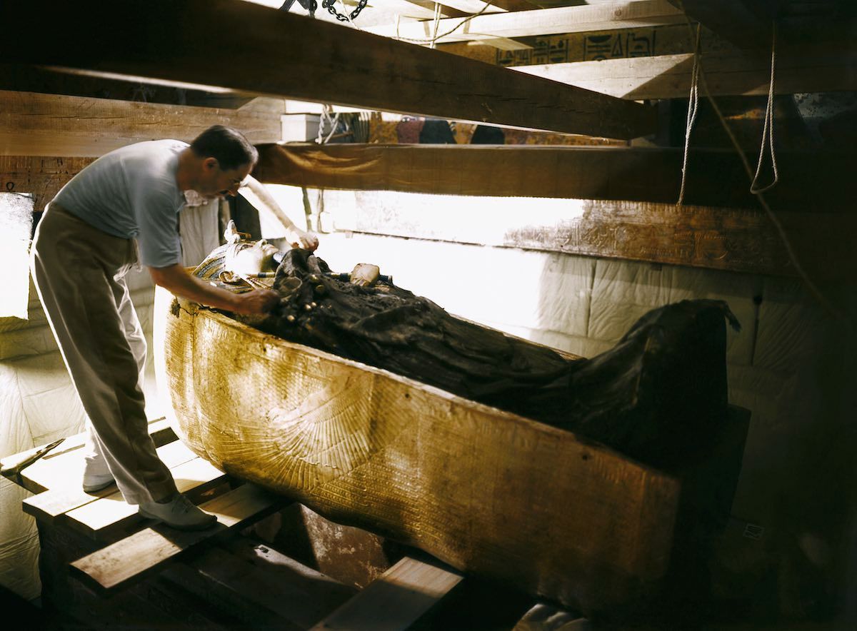 Tutankhamun’s Tomb, October 1925, Howard Carter working on the lid of the second coffin, colorized by Dynamichrome.