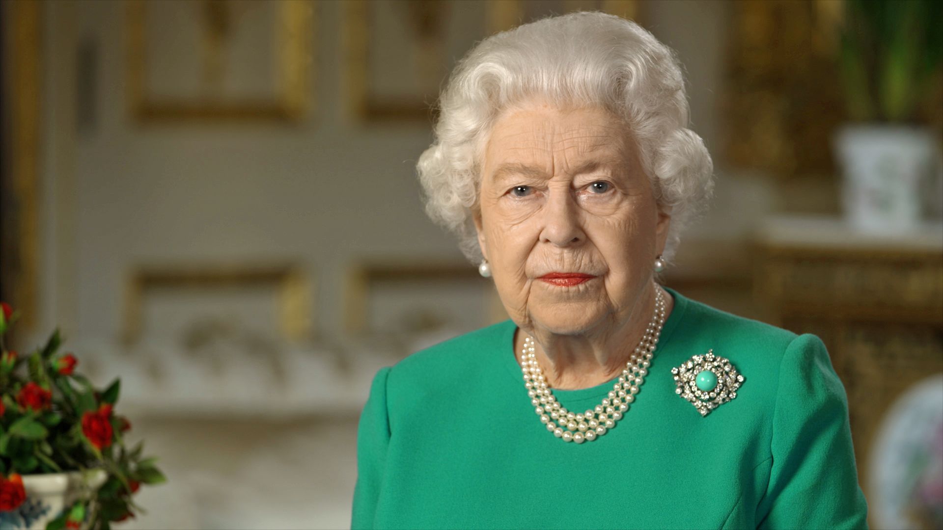 Queen Elizabeth II wearing a turquoise brooch in her April 2020 Covid speech