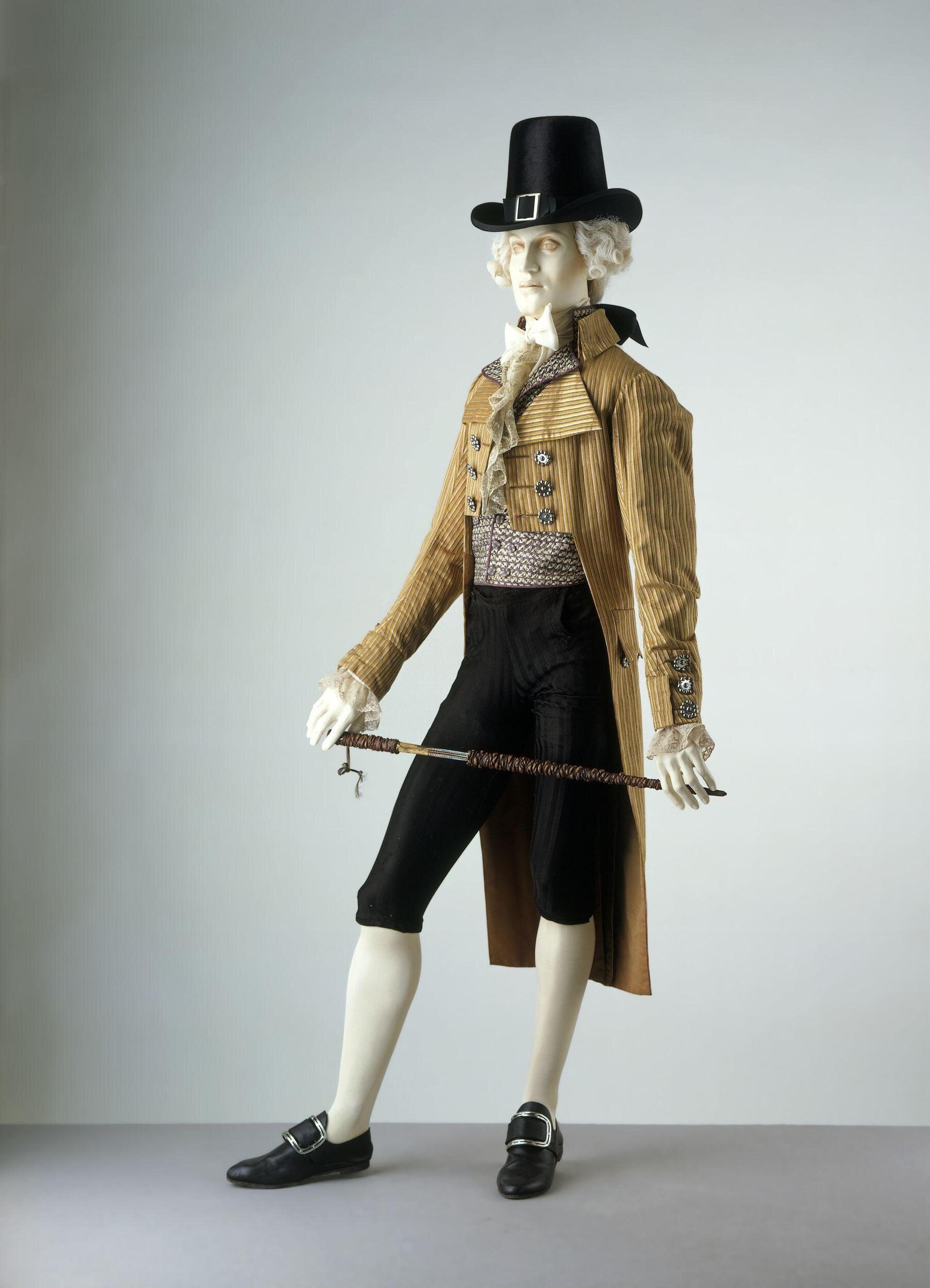 Cut steel was the perfect compliment to the exaggerated style fashionable in the late 1790s. Note the large lapel. Cut steel became popular for shoe buckles and buttons in the 1750s. It was a fraction of the price of paste. Coat, 1795-1805. The Victoria & Albert Museum.