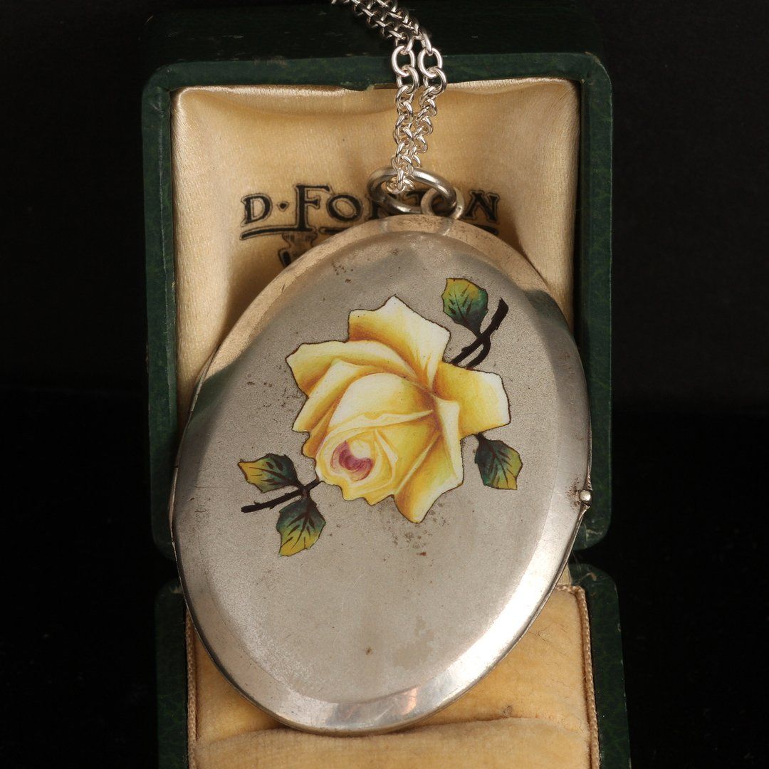 Detail of Late Victorian Silver Tone Locket with Yellow Enamel Rose