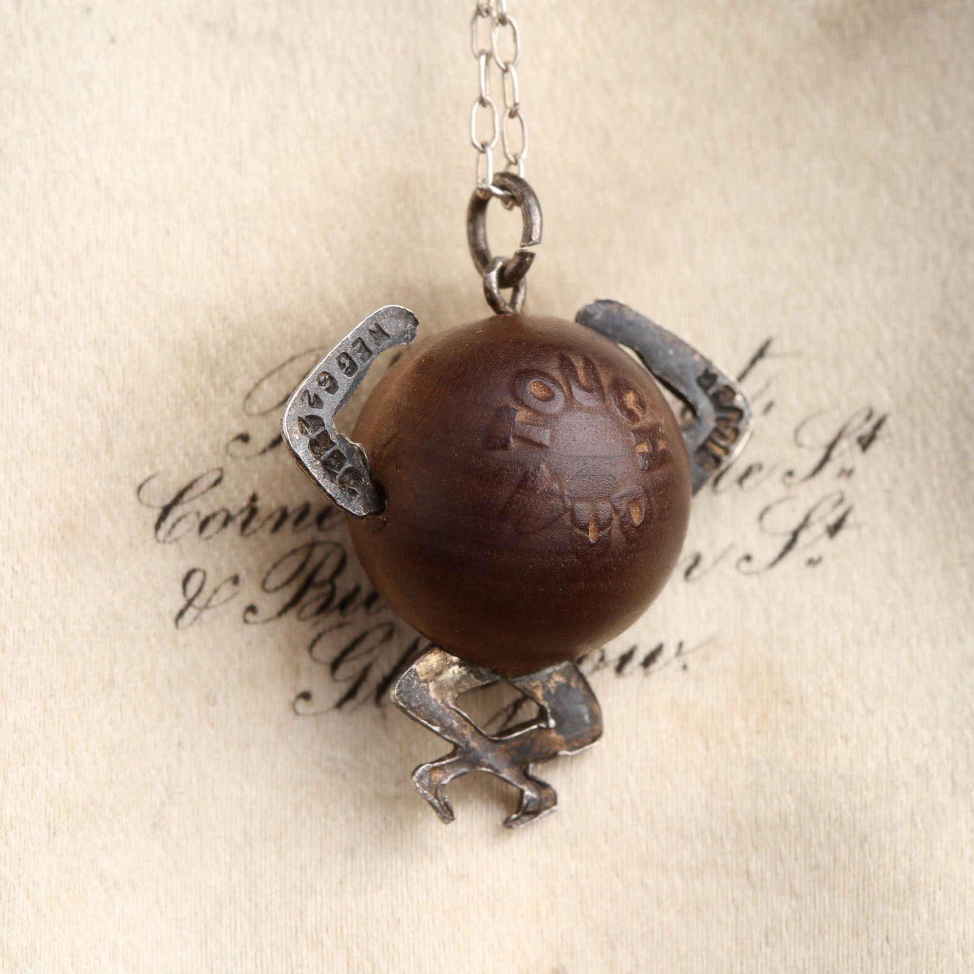 A well-worn "Touch wud" charm from the WW1 era. From the Erica Weiner Jewelry archives. 