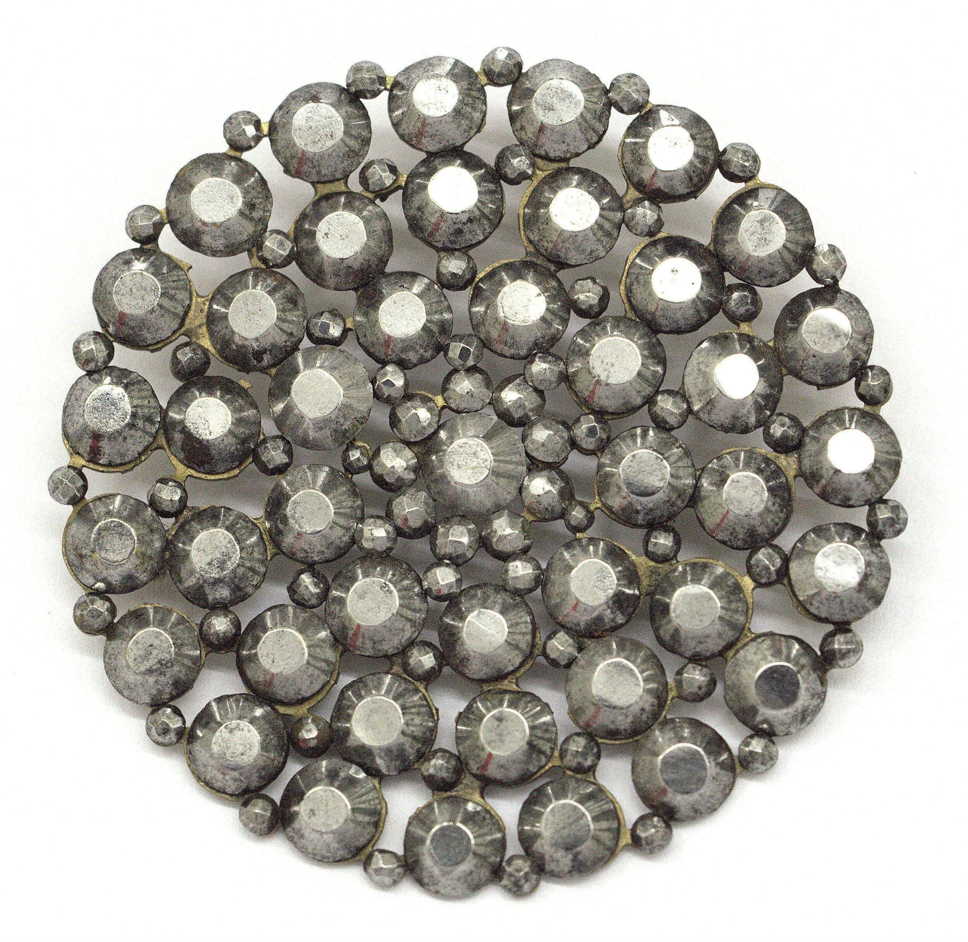 Cut steel button, 1850. Victoria & Albert Museum. 