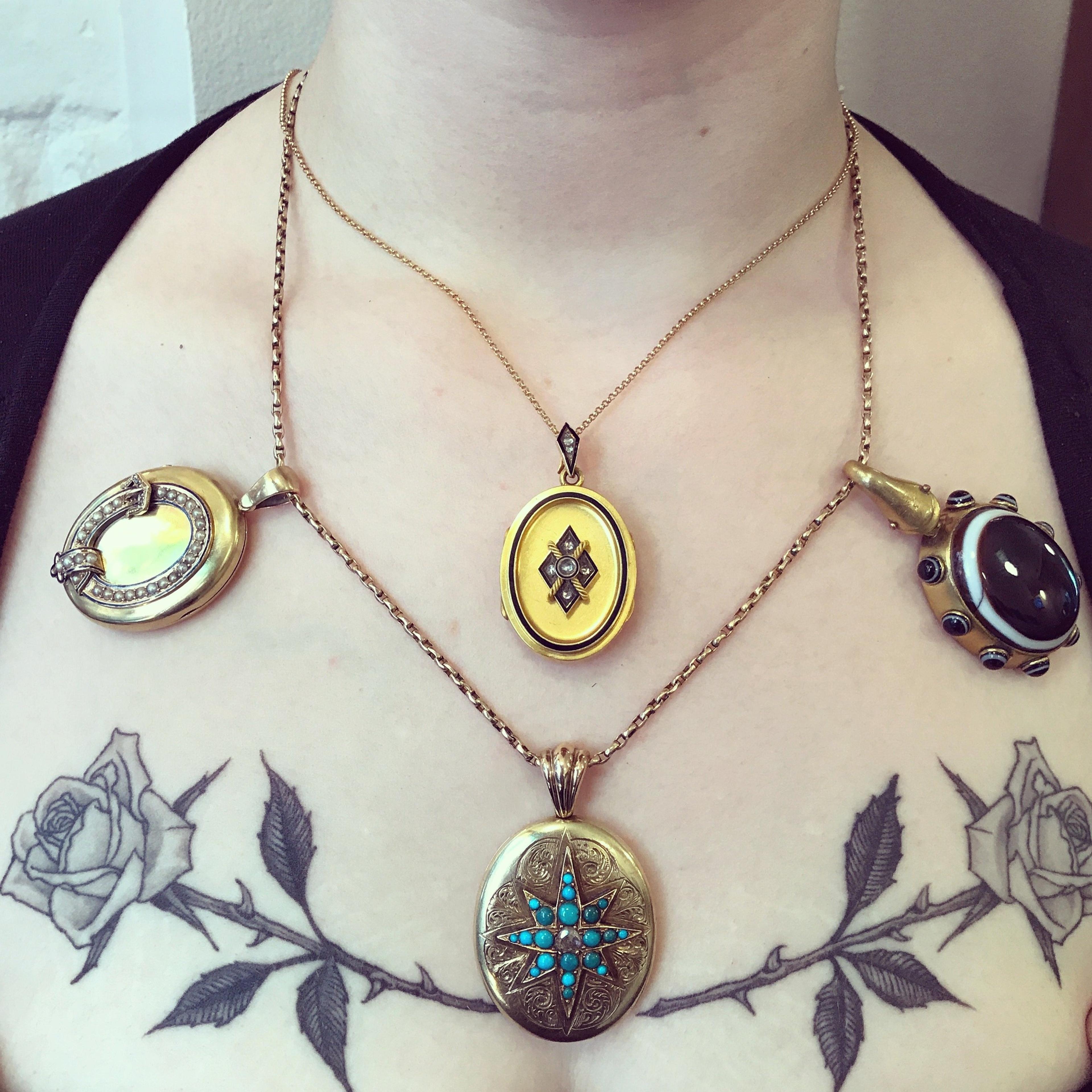 Closeup pf woman wearing the Victorian Turquoise and Diamond Starburst Locket