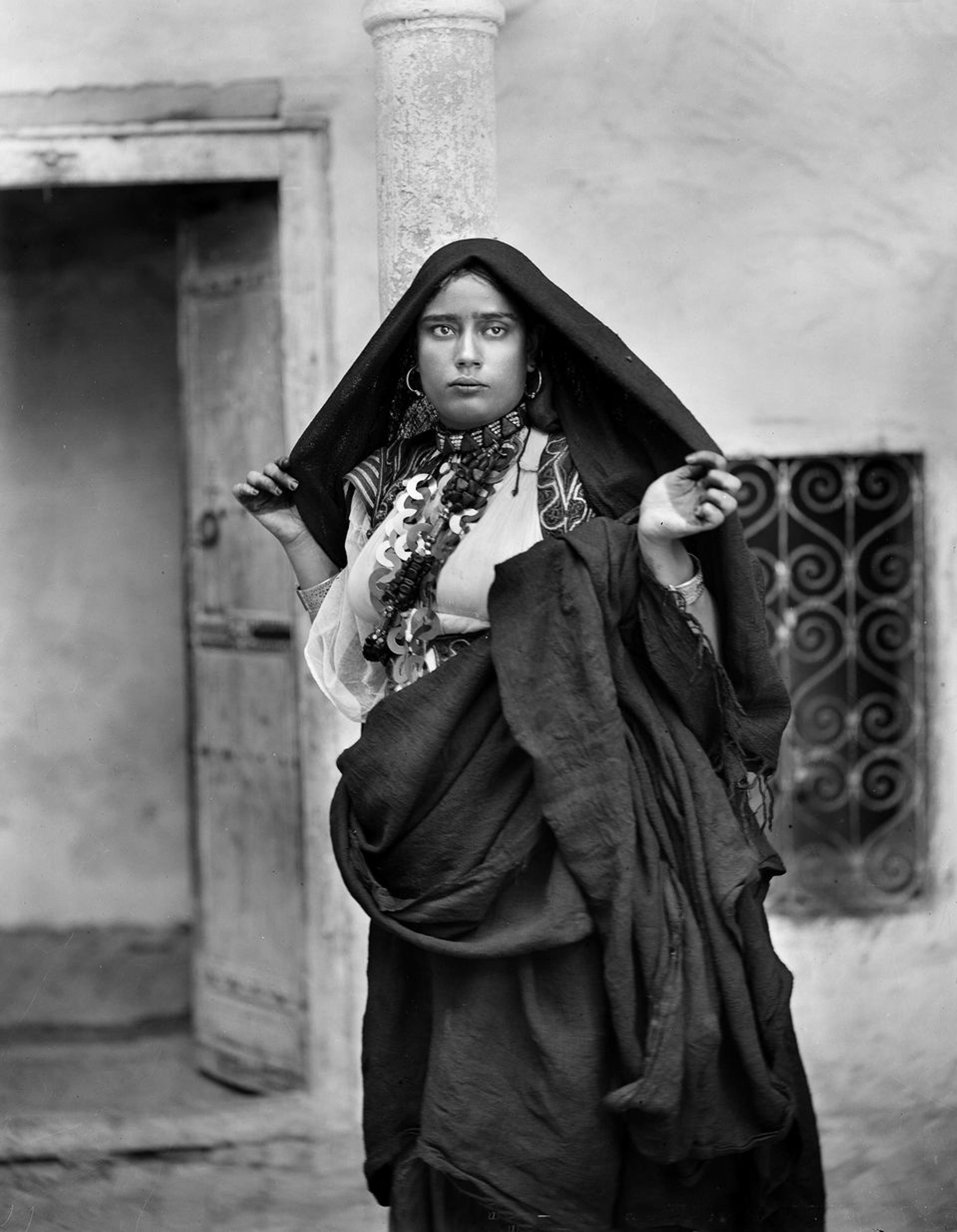 Photograph of woman wearing skhab necklace, c. 1890