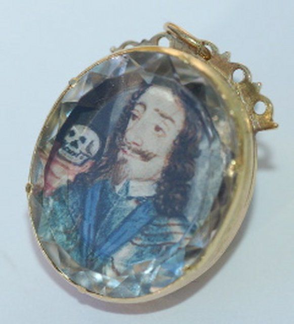 Stuart crystal pendant c. 1650-1660, set with a watercolor portrait on vellum. The skull signifies Charles's death. 