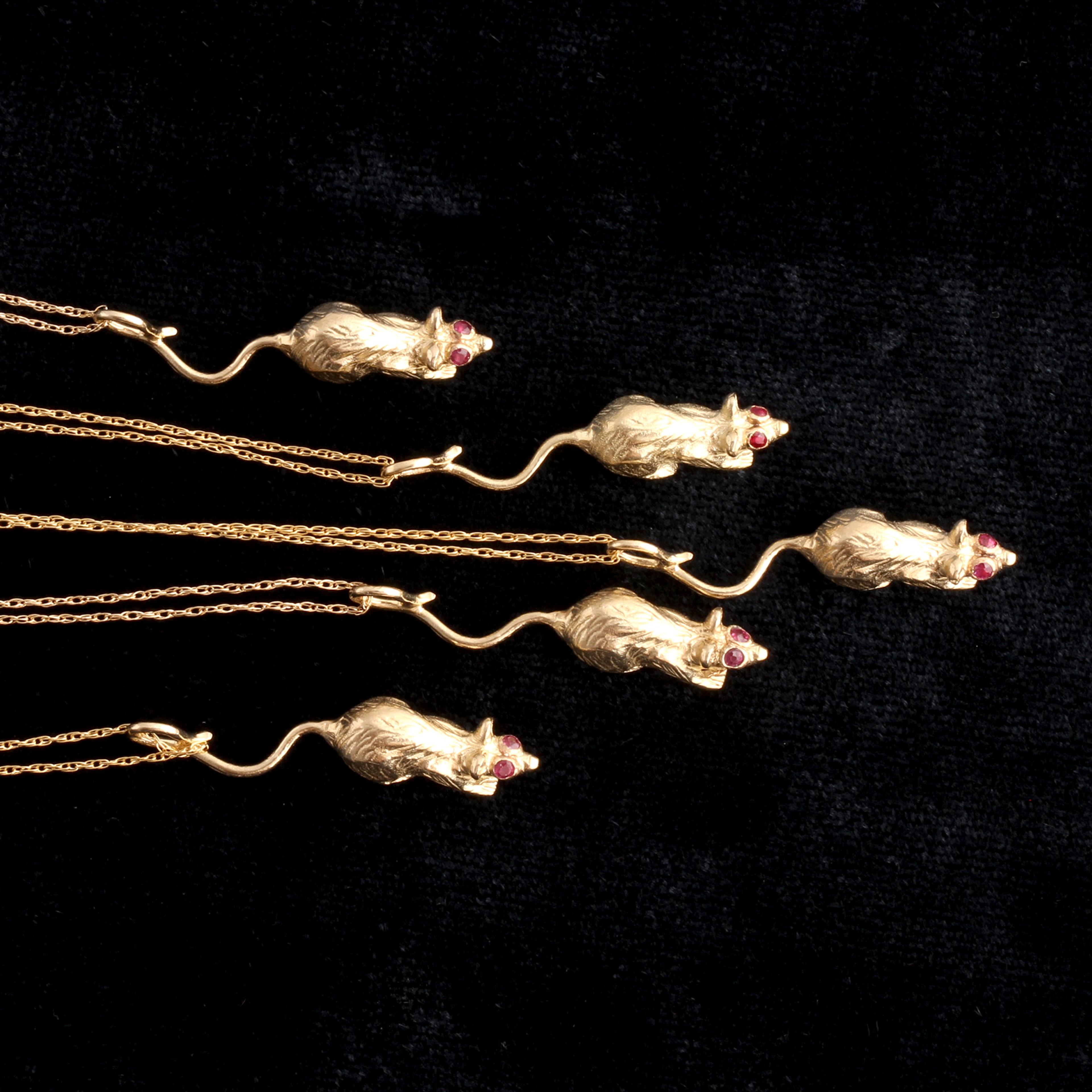 Detail of 5 ruby-eyed rat necklaces