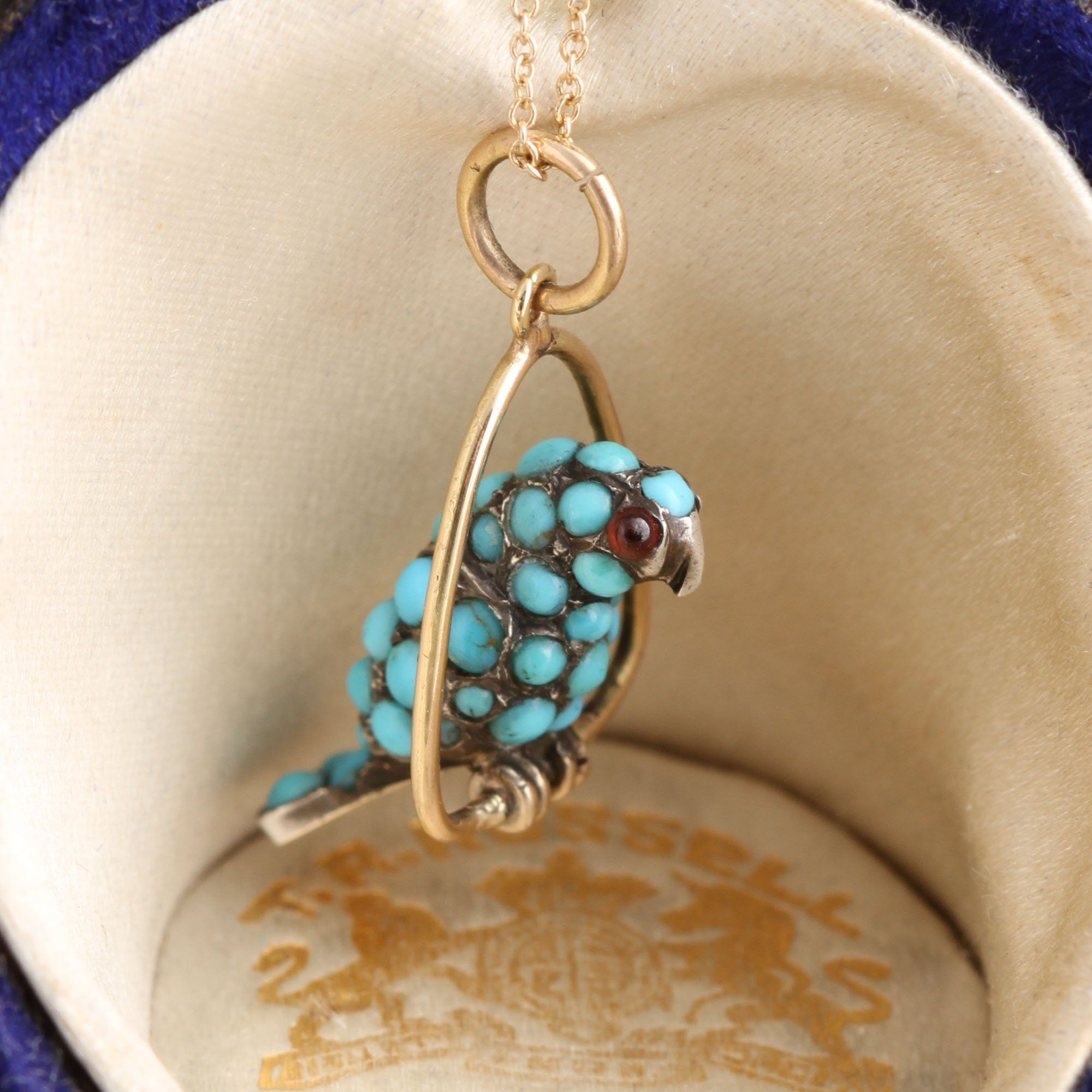 Detail of Victorian Turquoise and Garnet Parrot Charm Necklace