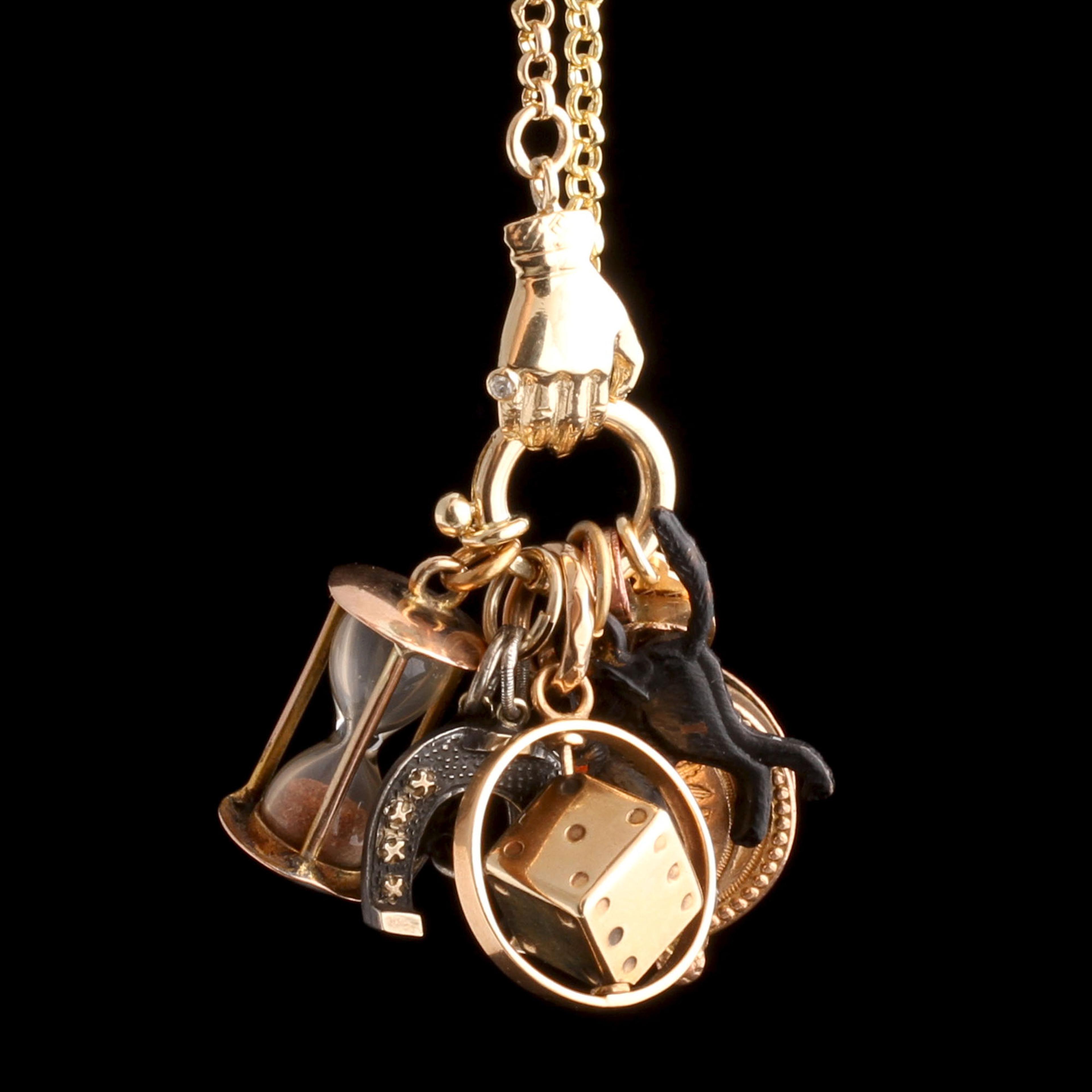 Detail of the hand on the Handclasp Charm Base Necklace with charms