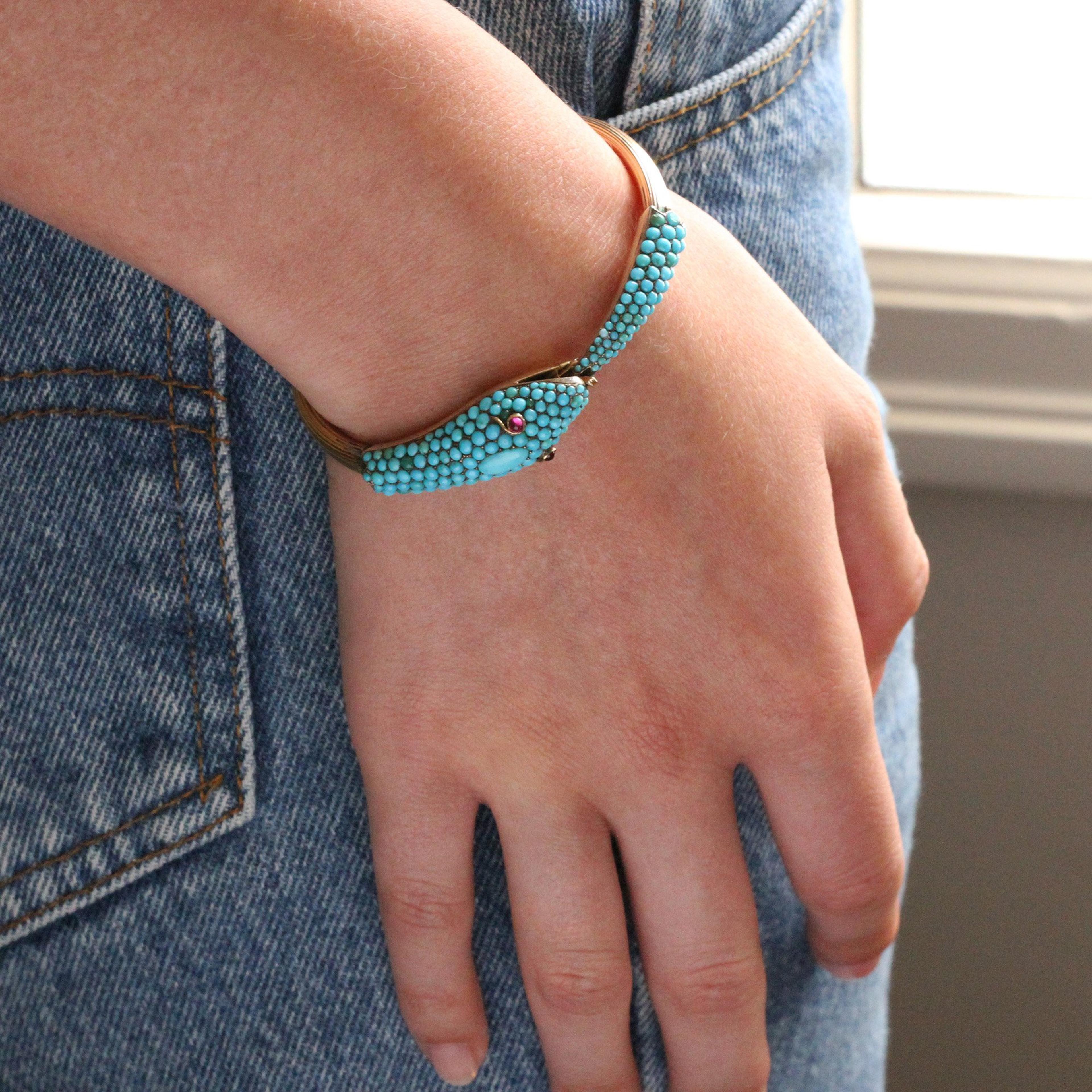 Closeup of someone wearing the Victorian Turquoise Pavé Serpent Bangle