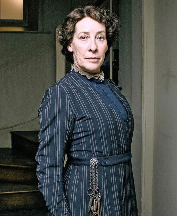 Downtown Abbey's Mrs. Hughes wearing a chatelaine.