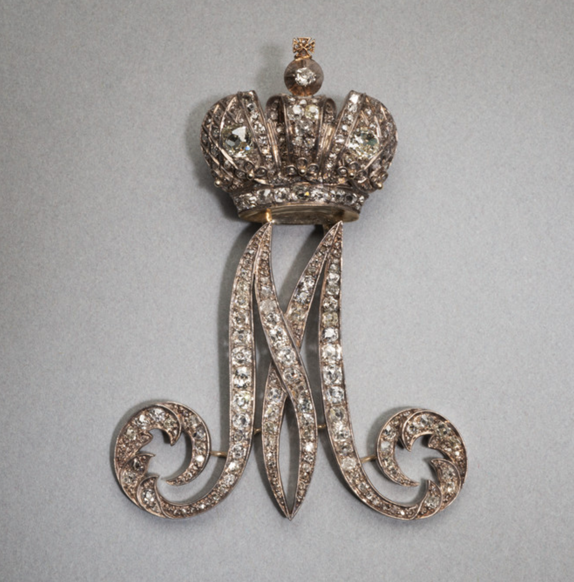 This is the cypher for Empress Maria Fedorovna (Empress of Russia from 1881-1894). These were known as “Maids of Honor pins” and were wore on the left shoulder. This tradition began in the early 18th century as part of Peter the Great’s efforts to westernize the court. Hillwood Museum.  