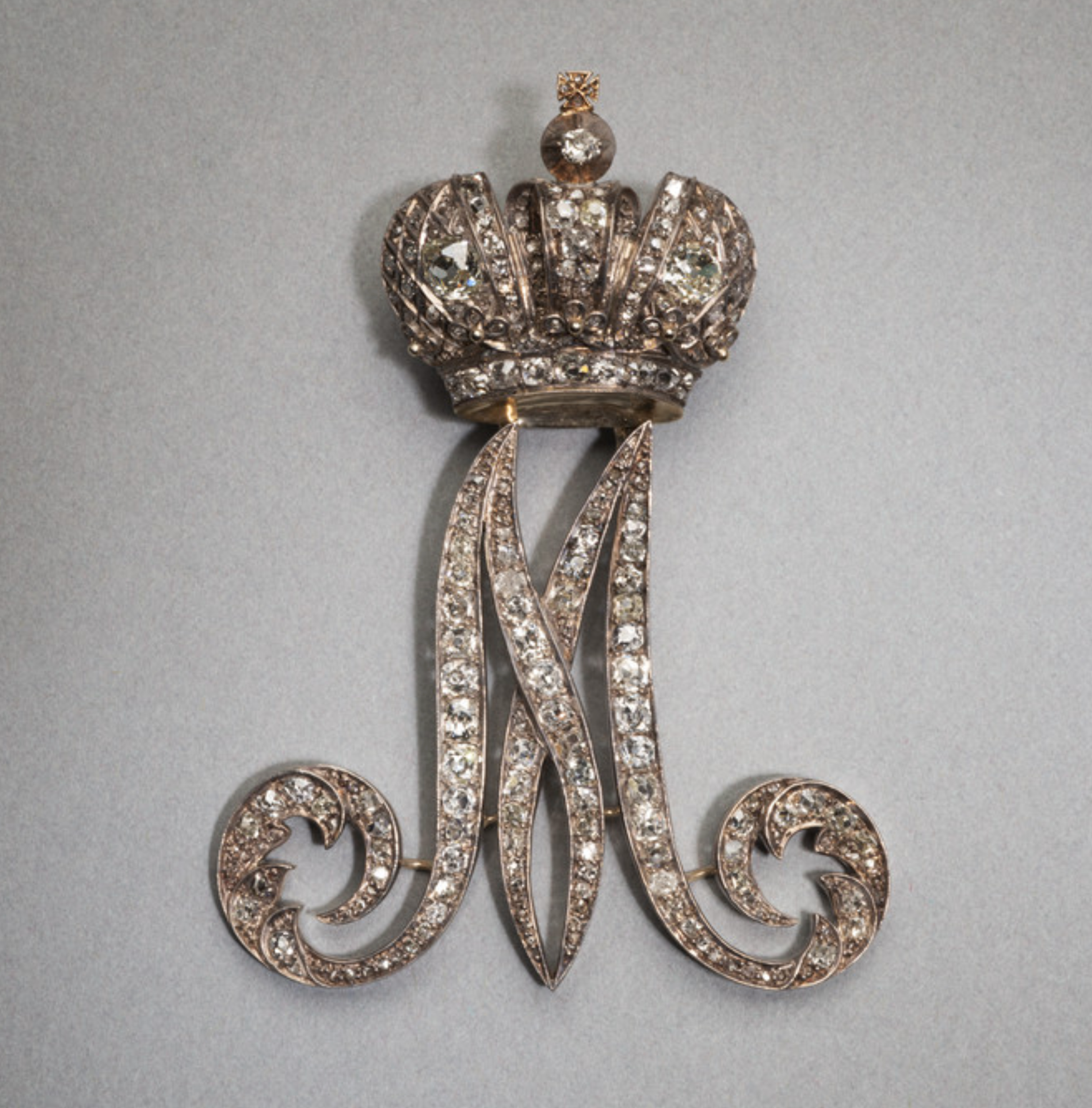 This is the cypher for Empress Maria Fedorovna (Empress of Russia from 1881-1894). These were known as “Maids of Honor pins” and were wore on the left shoulder. This tradition began in the early 18th century as part of Peter the Great’s efforts to westernize the court. Hillwood Museum.