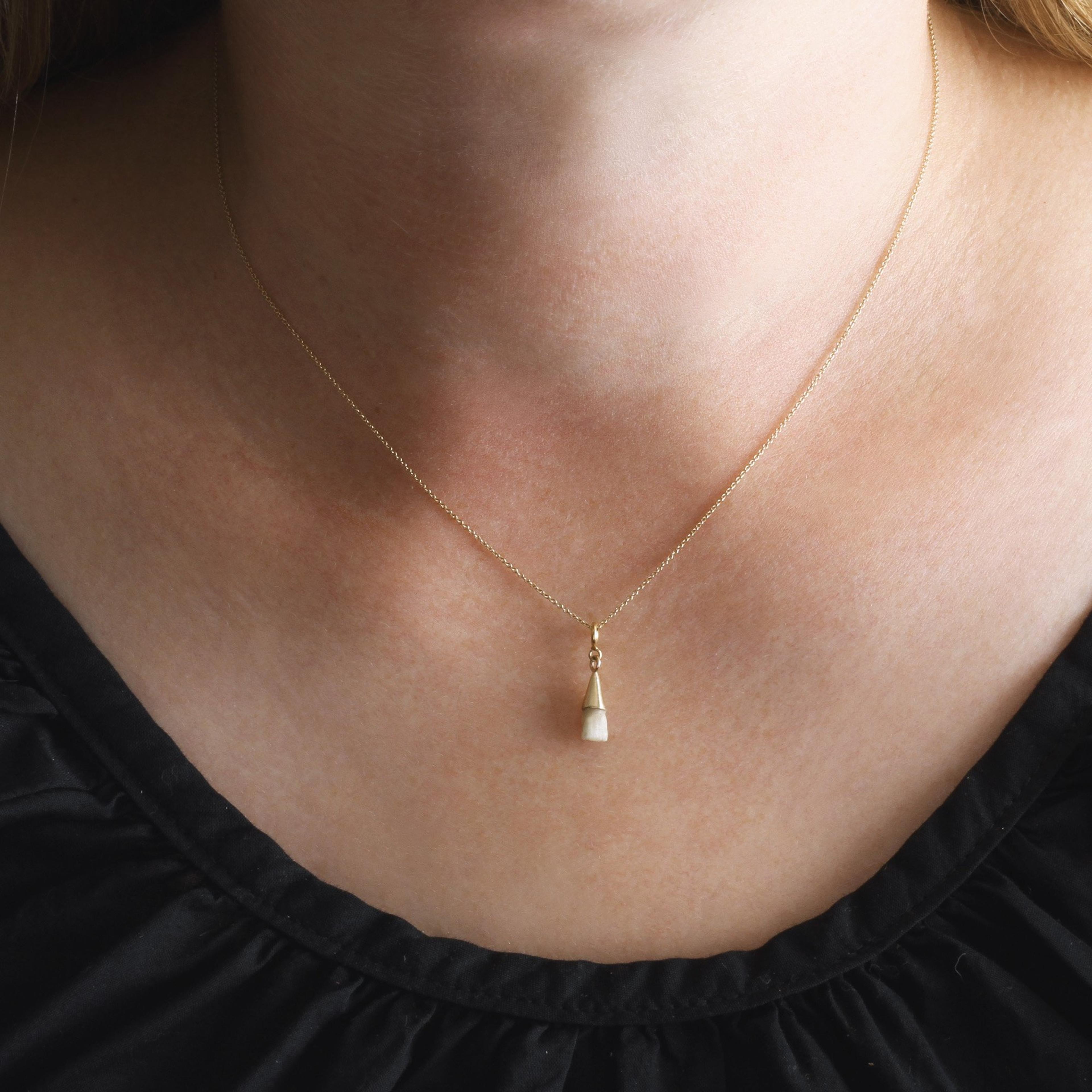 Baby tooth necklace on a model
