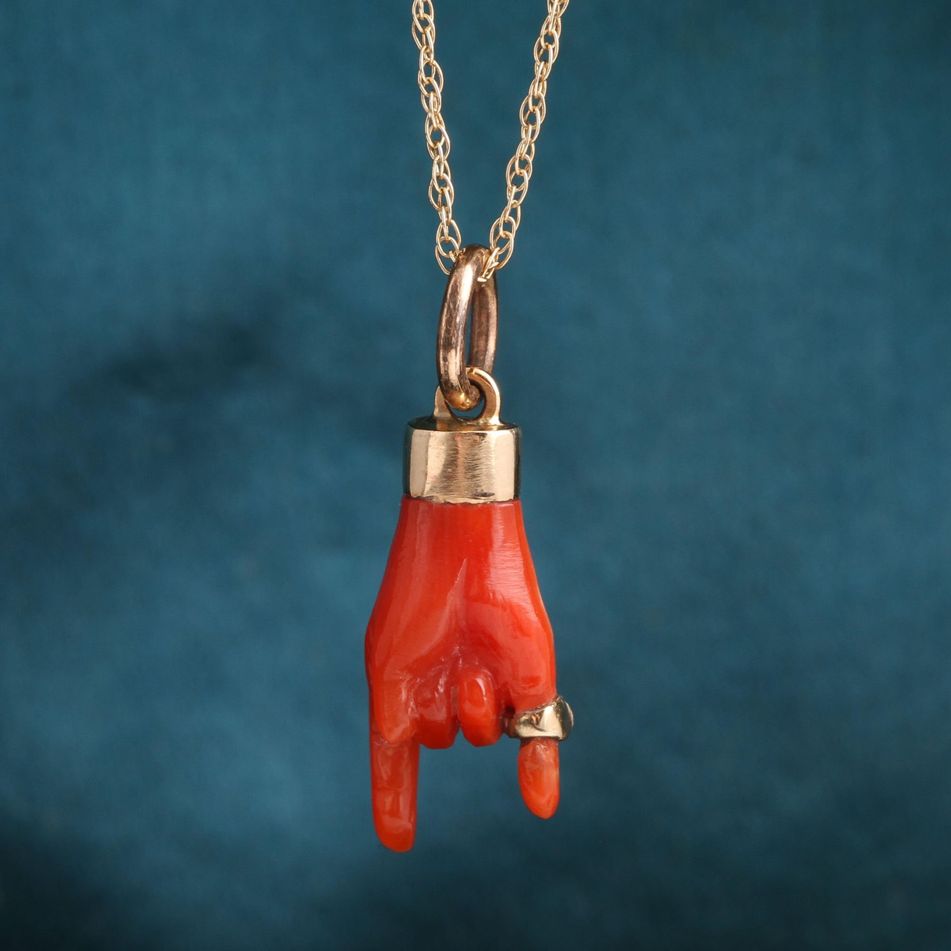 Detail of Coral Mano Cornuto with Pinky Ring Necklace