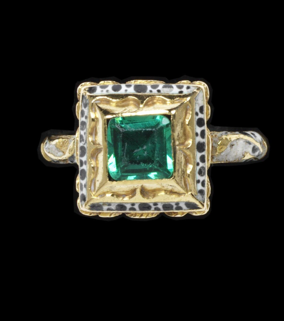 Enameled gold ring set with glass emerald, 1650-1700. The Victoria & Albert Museum.